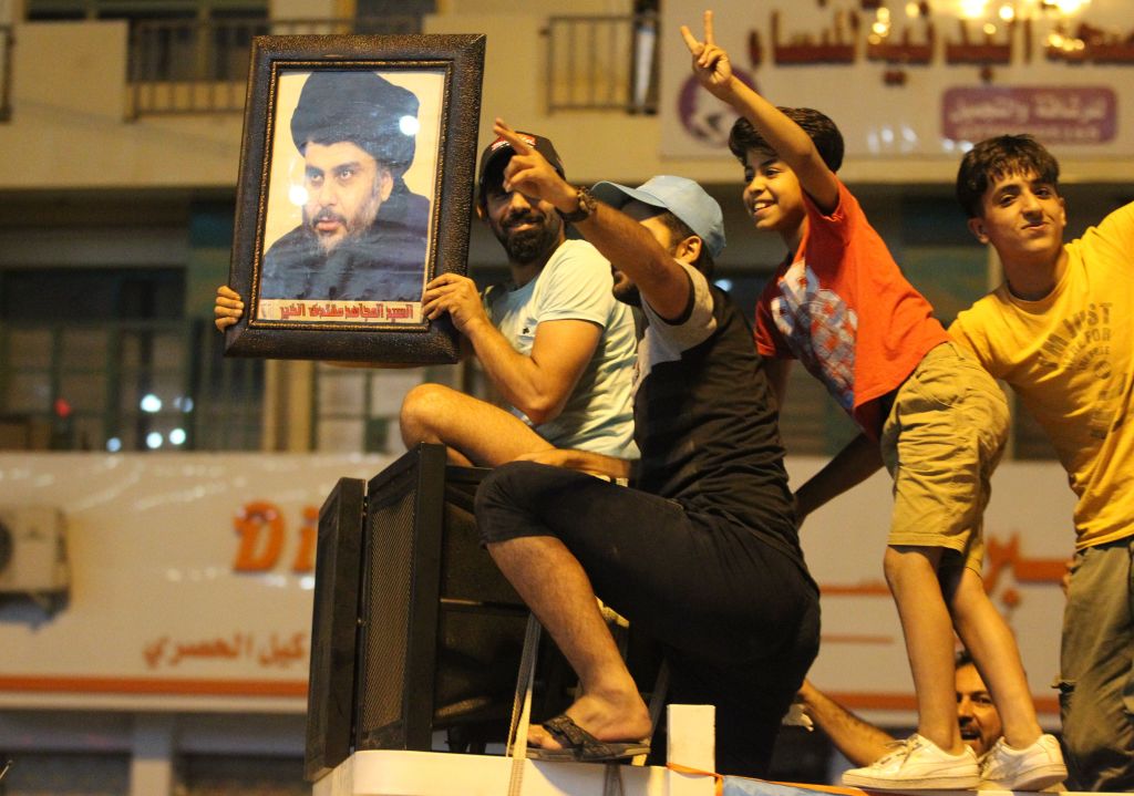 Supporters of Iraqi Shiite cleric Muqtada al-Sadr celebrate strong electoral results