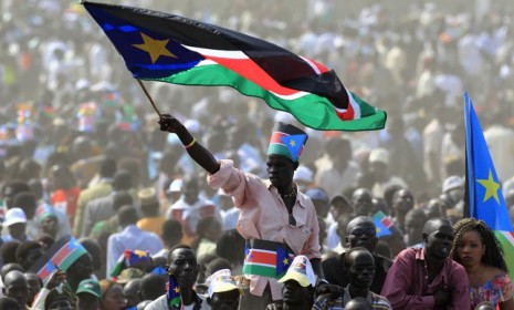 A man waves the South Sudan&#039;s national flag during its Independence Day celebrations Saturday