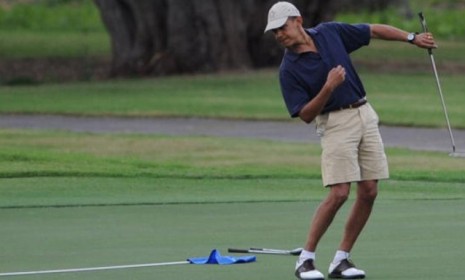 Obama relaxes with a round of golf.