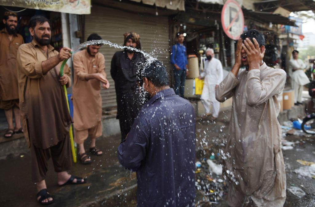 People in Karachi try to cool off during a heatwave.