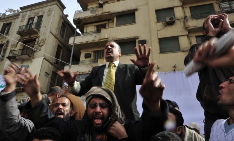 Muslim Brotherhood member Mohamed el-Balatagy (top-center) protests in Cairo&#039;s Tahrir Square last week.