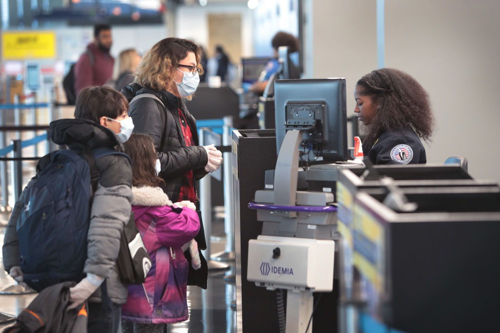 Passenger go through TSA screening at a nearly-deserted O&#039;Hare International Airport on April 2, 2020 in Chicago, Illinois