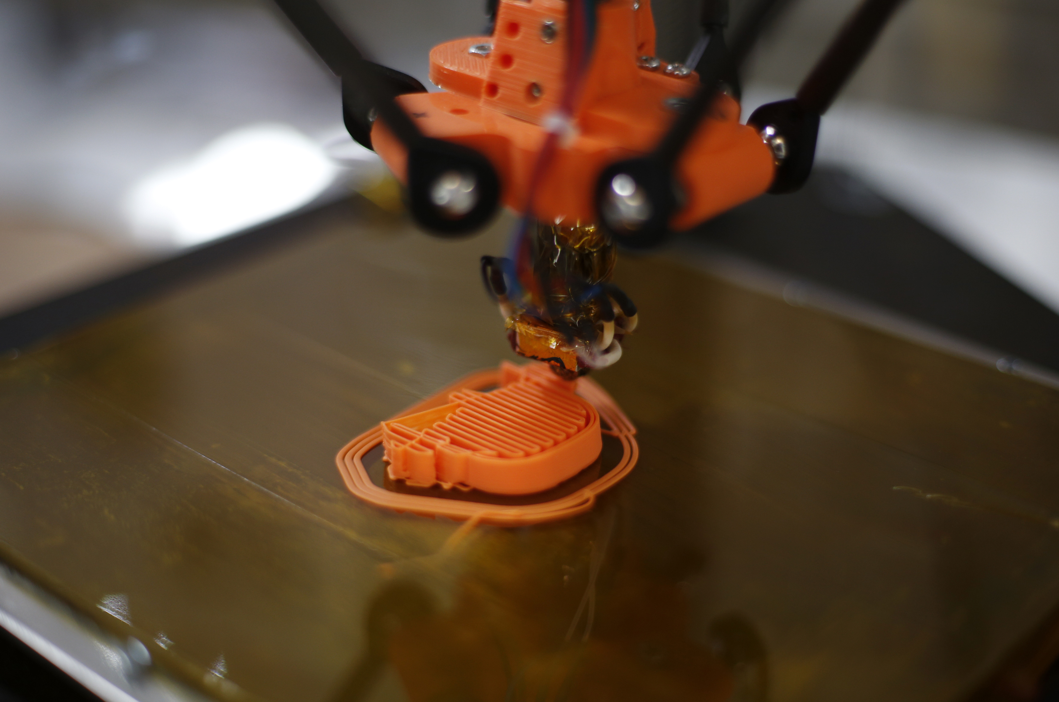 A 3-D printer in action.