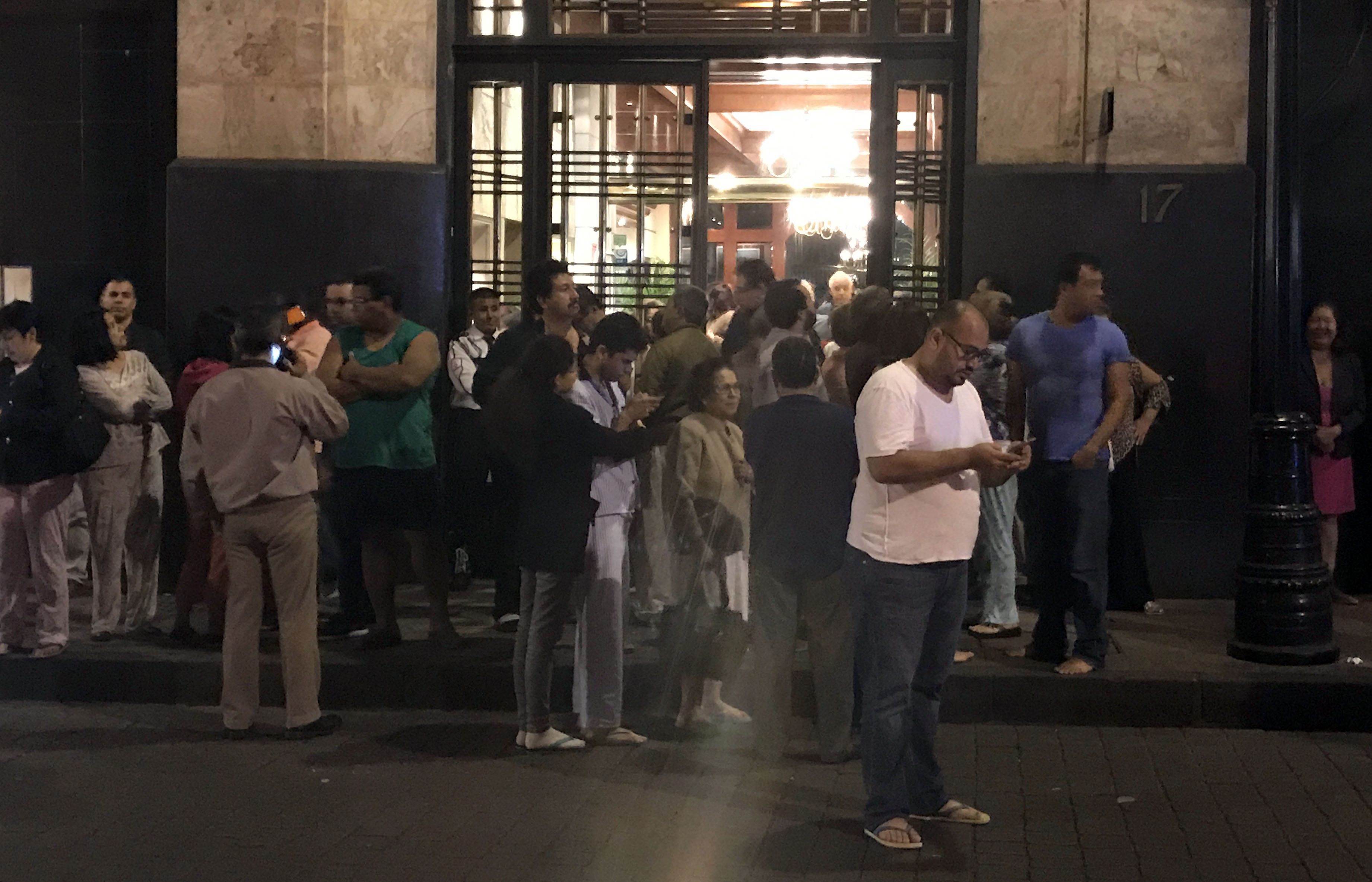 Residents of Mexico City wait outside as buildings sway from earthquake