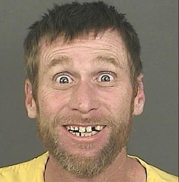 This may be the happiest mug shot of all time