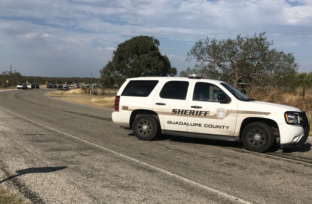 Police investigate a shooting at a church in Sutherland Springs, Texas