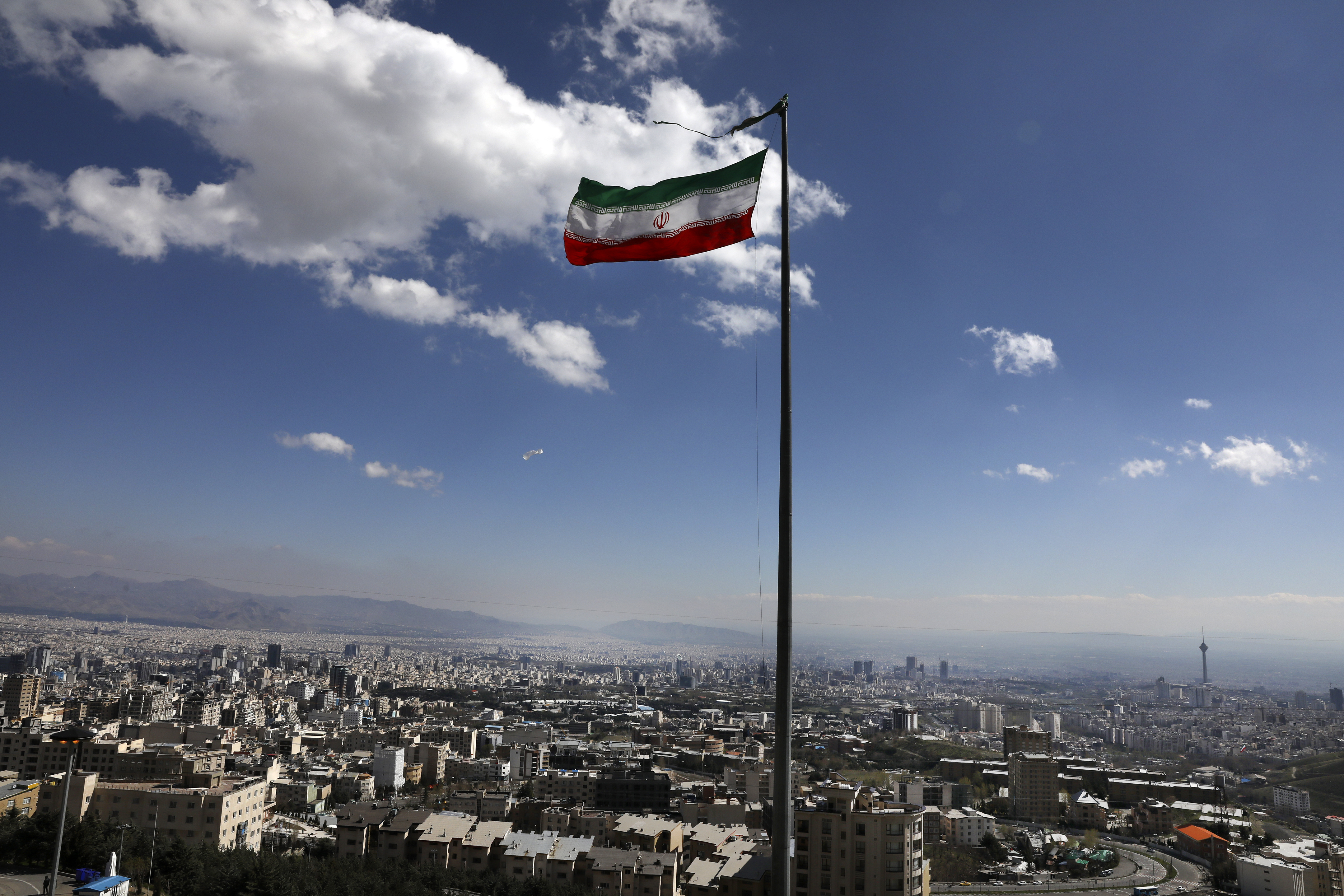 Iranian flag over Tehran.