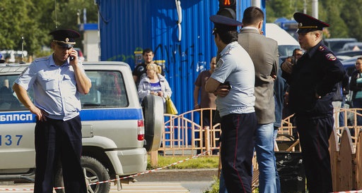 Russian police on the scene after a stabbing attack in Surgut