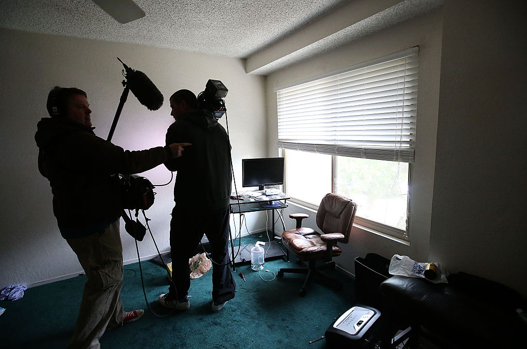 Reporters inspect the home of shooting suspect Syed Farook