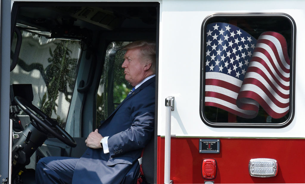 President Trump sits in a fire truck