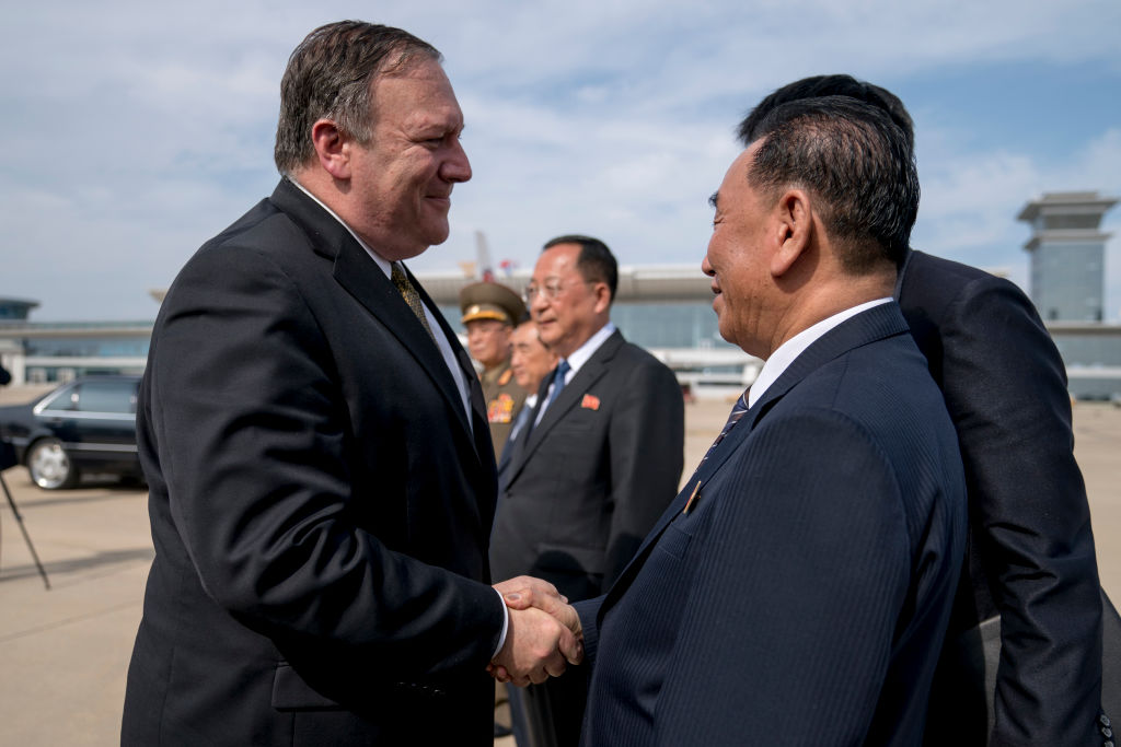 Secretary of State Mike Pompeo says goodbye to Kim Yong Chol (R), North Korean senior ruling party official and former intelligence chief, before boarding his plane at Sunan International Air