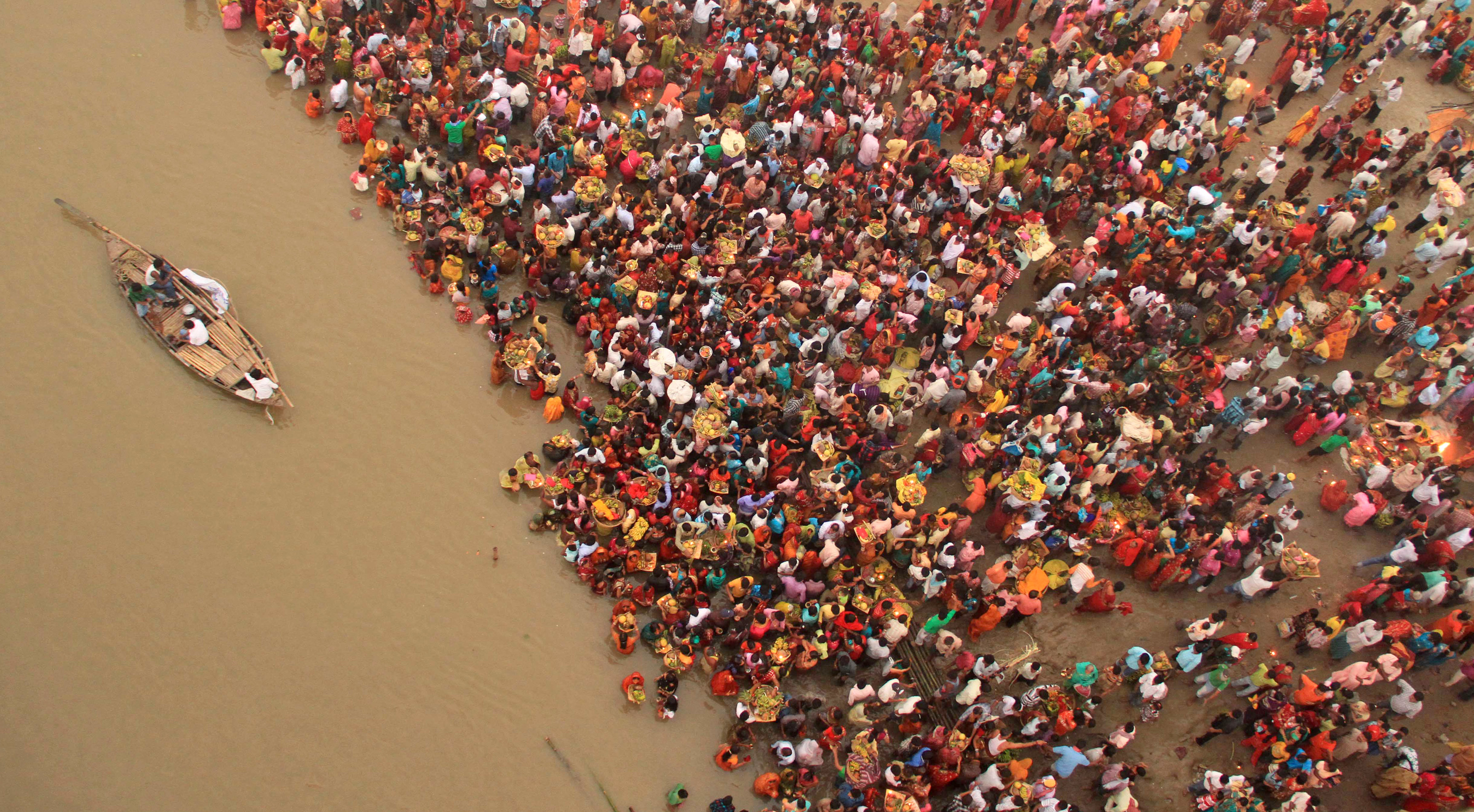 Hindu devotees gather to worship in the river Ganges in Patna, India.