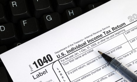 The typical American family of four spends about 40 hours a year filling out and filing their tax return.