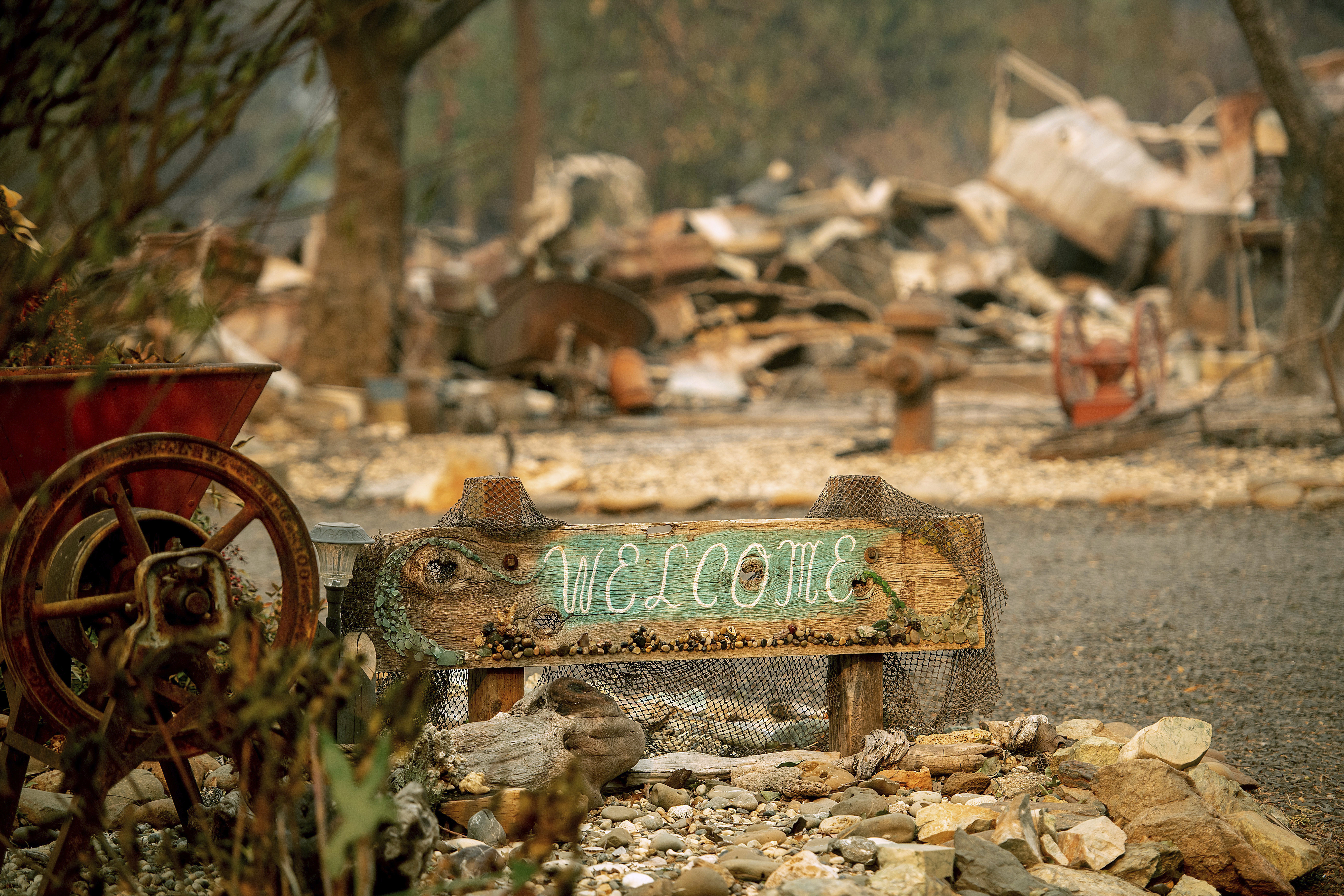 A welcome sign outside a destroyed home in Paradise, California.