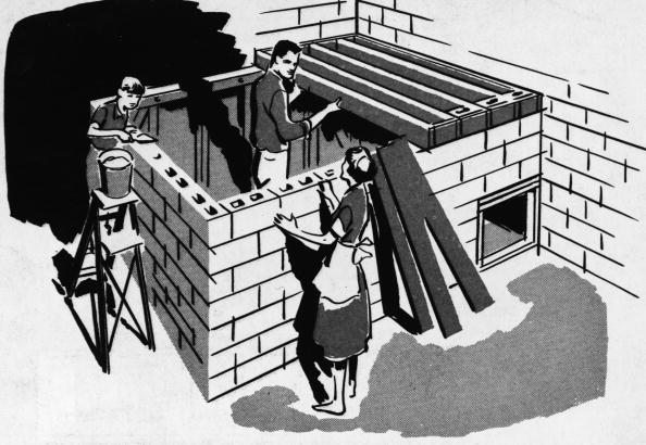 A vintage illustration of a family building a bomb shelter.