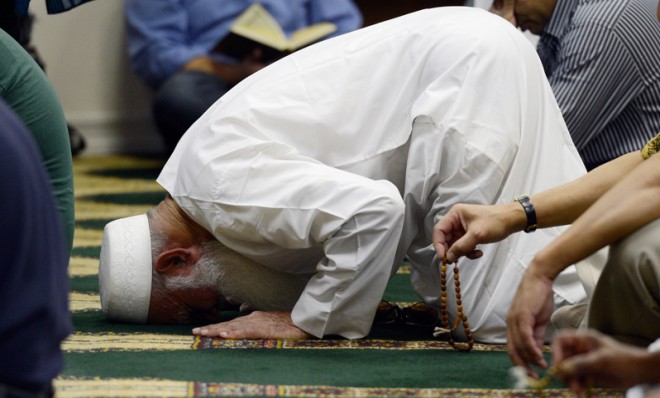  Muslims attend Friday prayer services at the Islamic Center of Southern California on September 14, 2012.