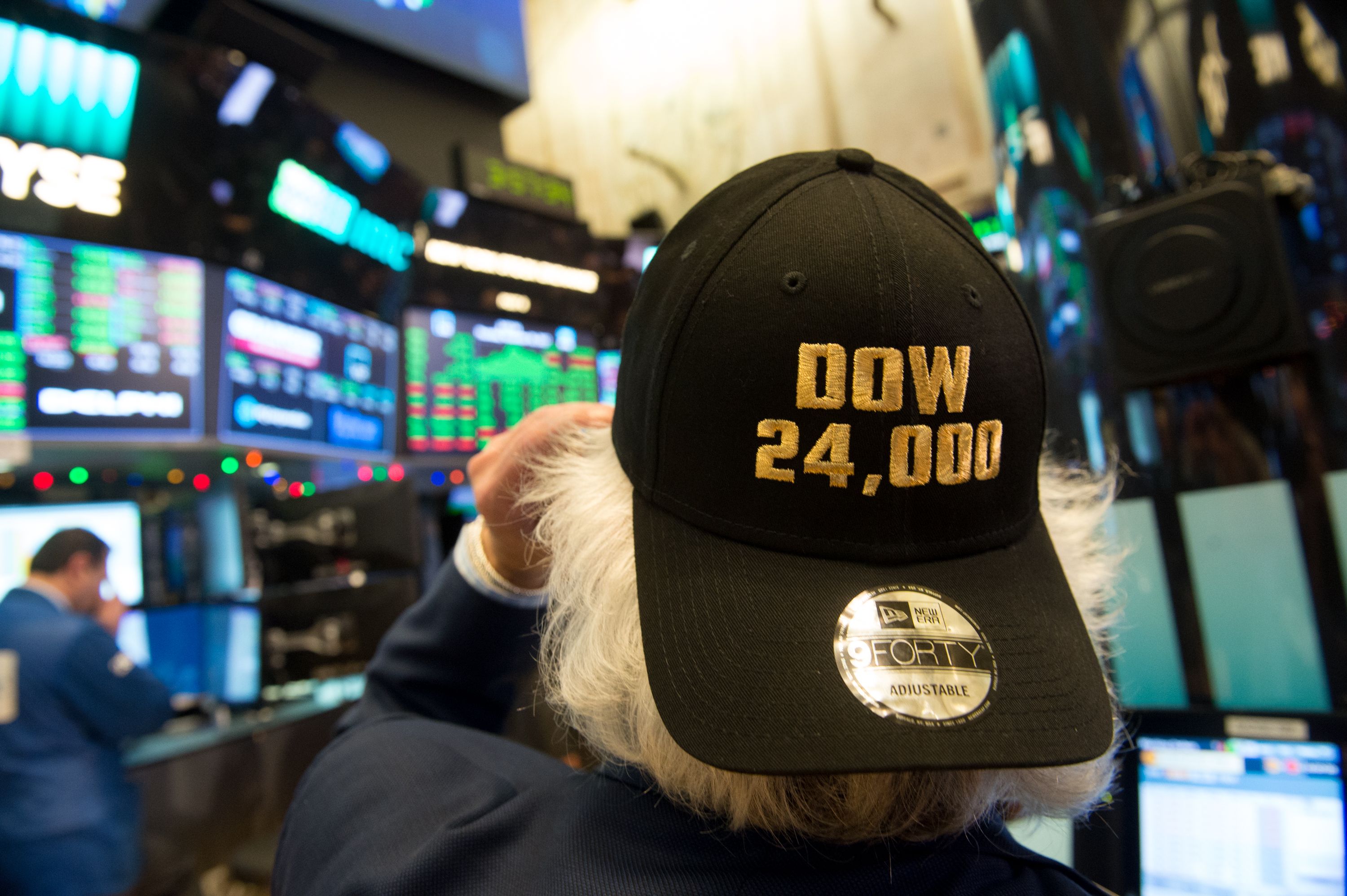 A trader at the Dow Industrial Average closing