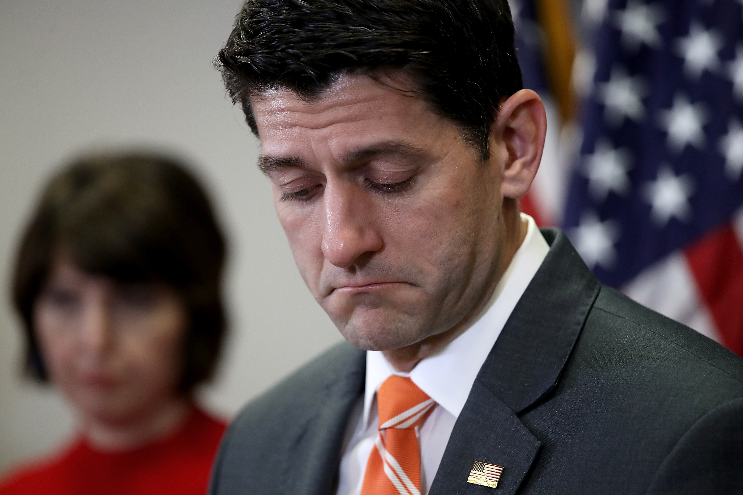 Paul Ryan frowns during a press conference 