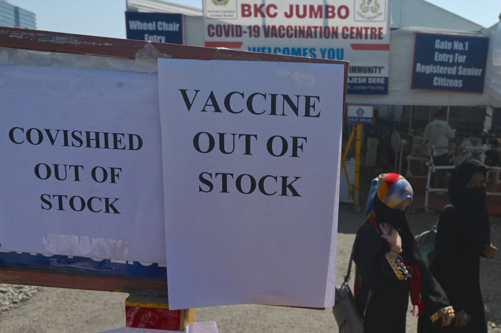 Signs indicating Oxford-AstraZeneca vaccines are out of stock in India.