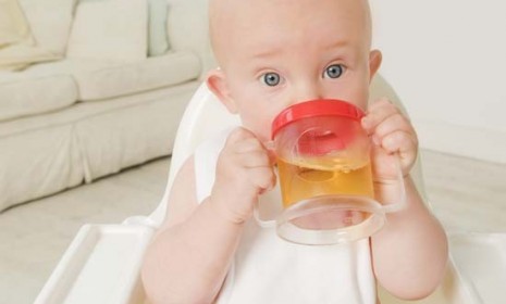 A baby sips apple juice: TV host Dr. Oz raised parental anxiety levels last week when he said fruit drink has dangerous levels of arsenic, which the FDA quickly shot down.