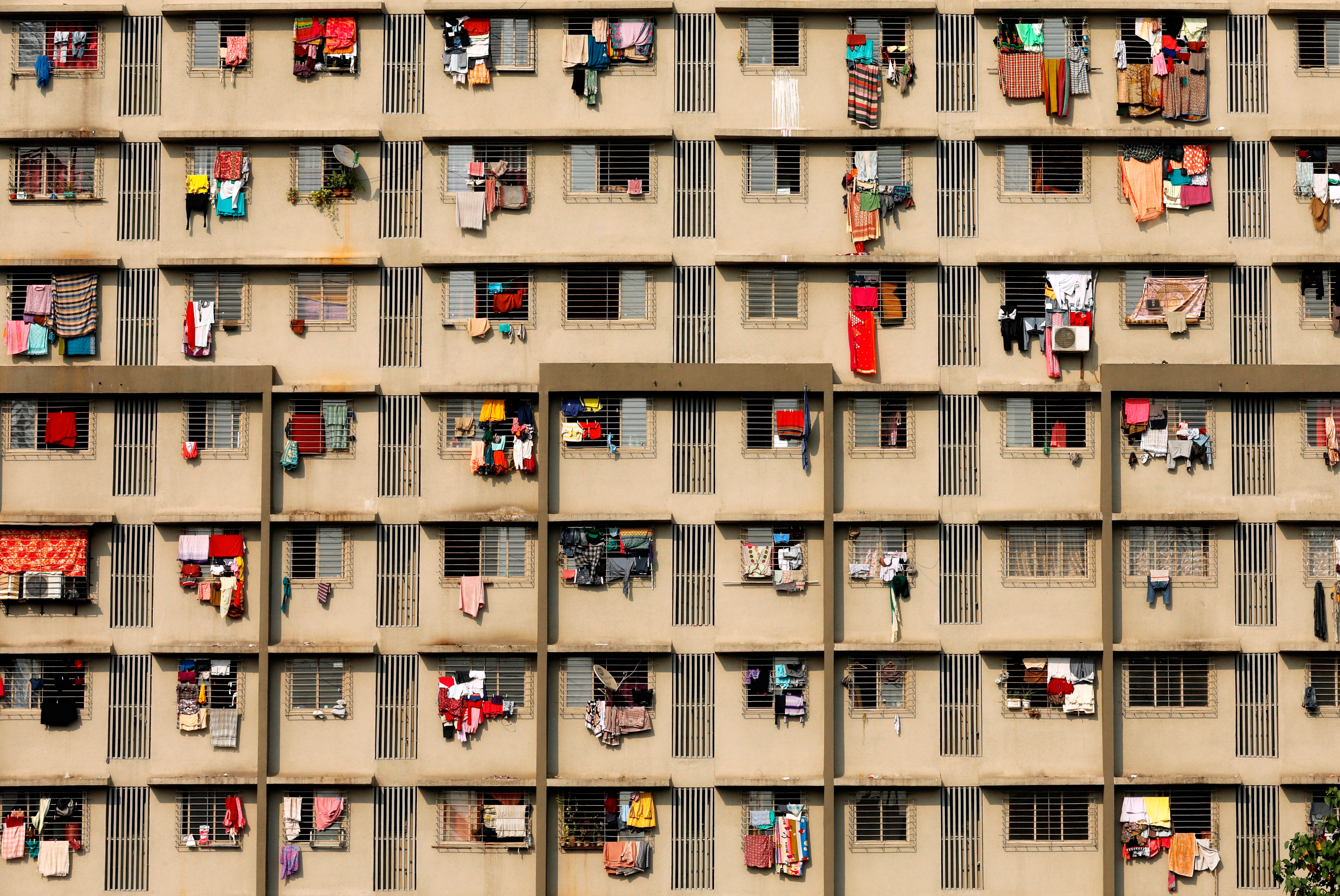 Laundry hangs from windows in Mumbai, India. 