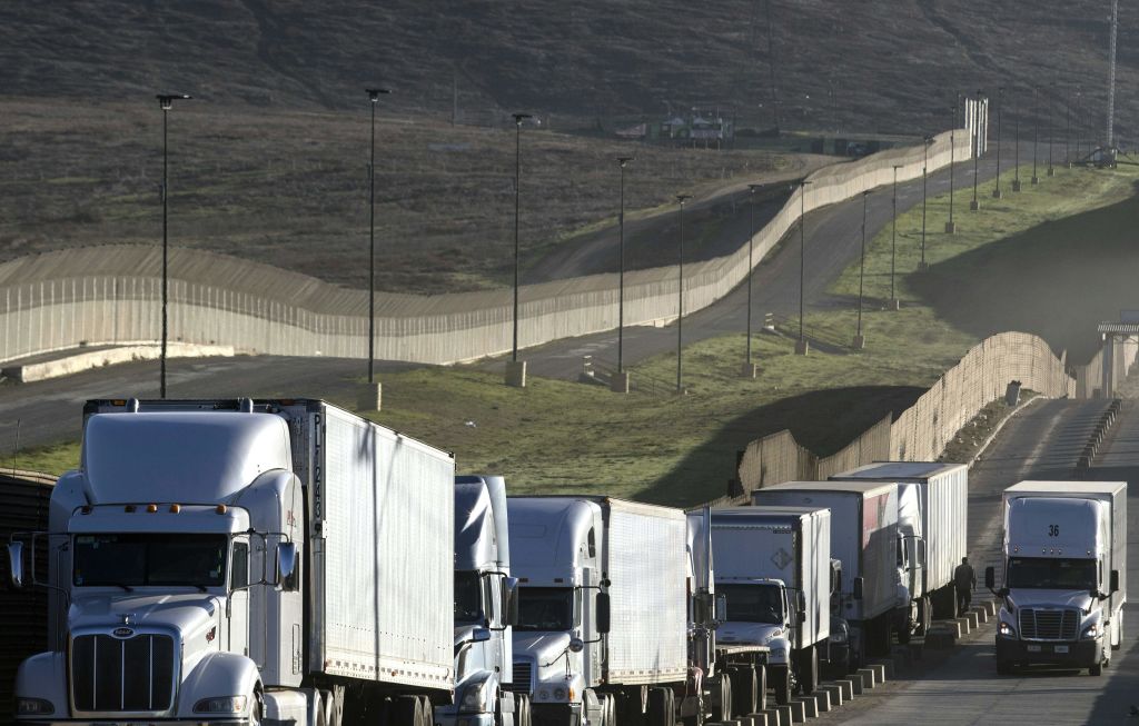 Trucks get ready to cross over from Mexico to the U.S.
