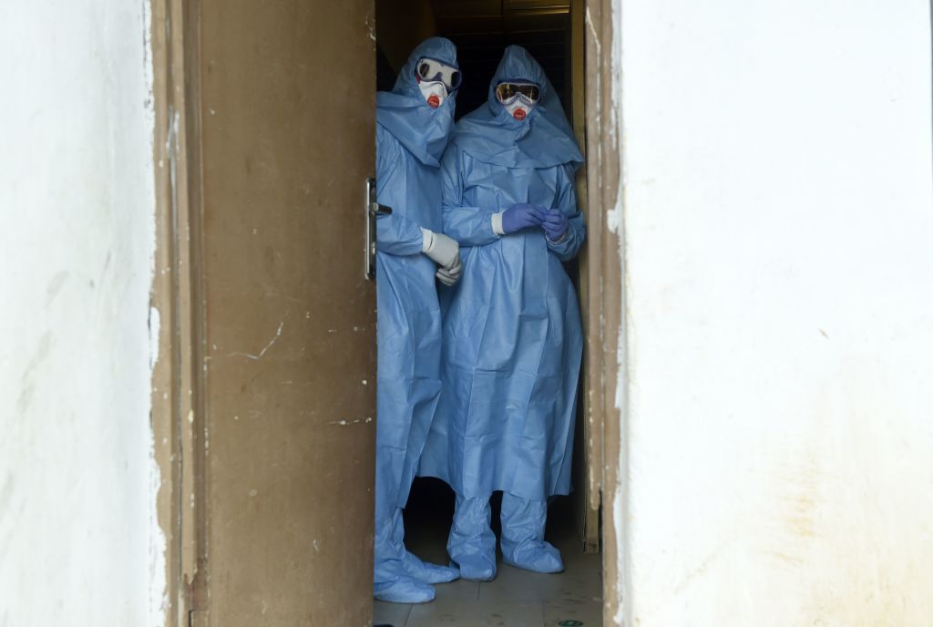  Health officials treat ebola patients in Nigeria.
