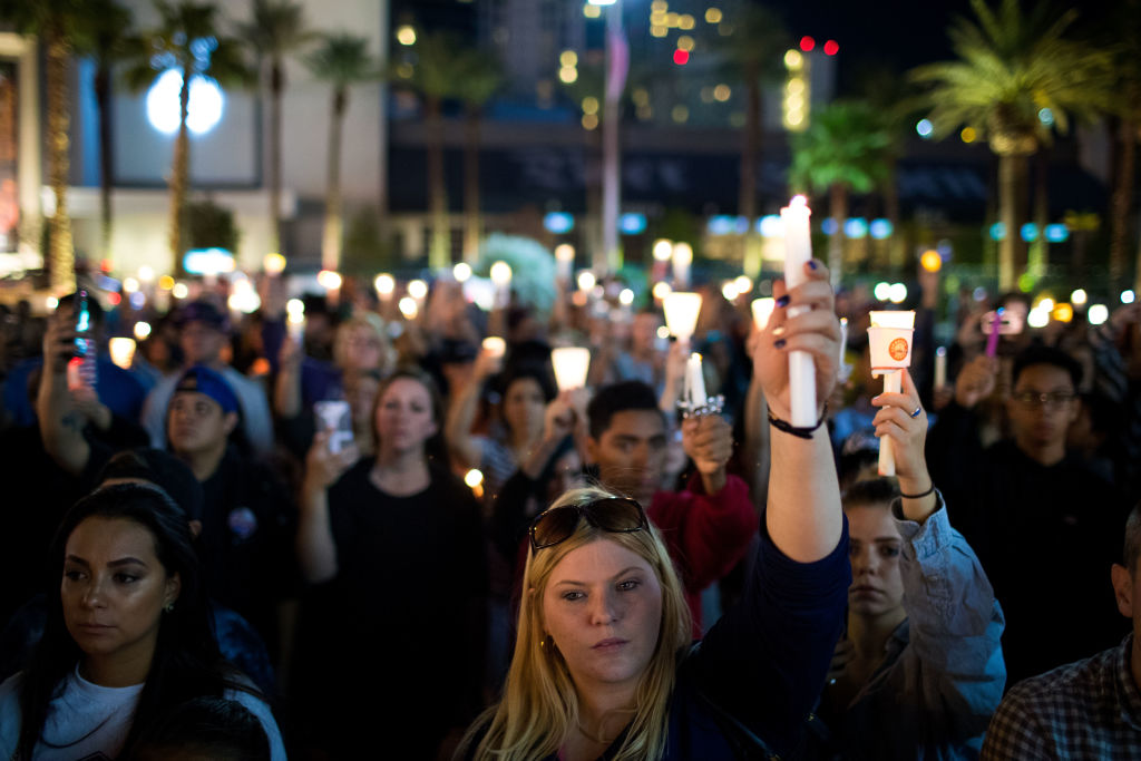 Mourners hold candles in Las Vegas following mass shooting