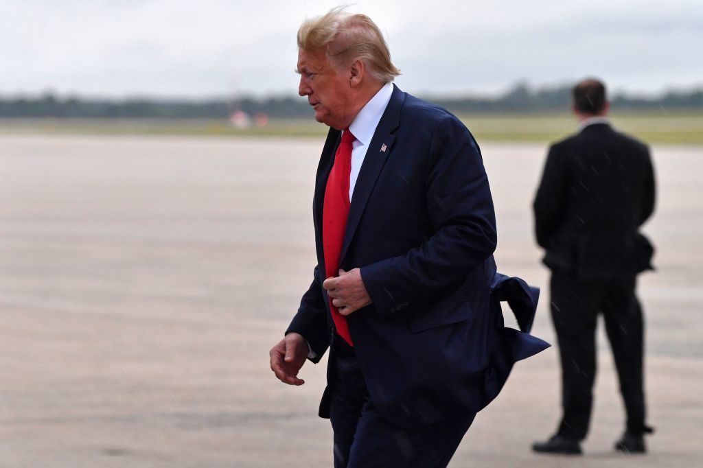 Trump walks against the wind