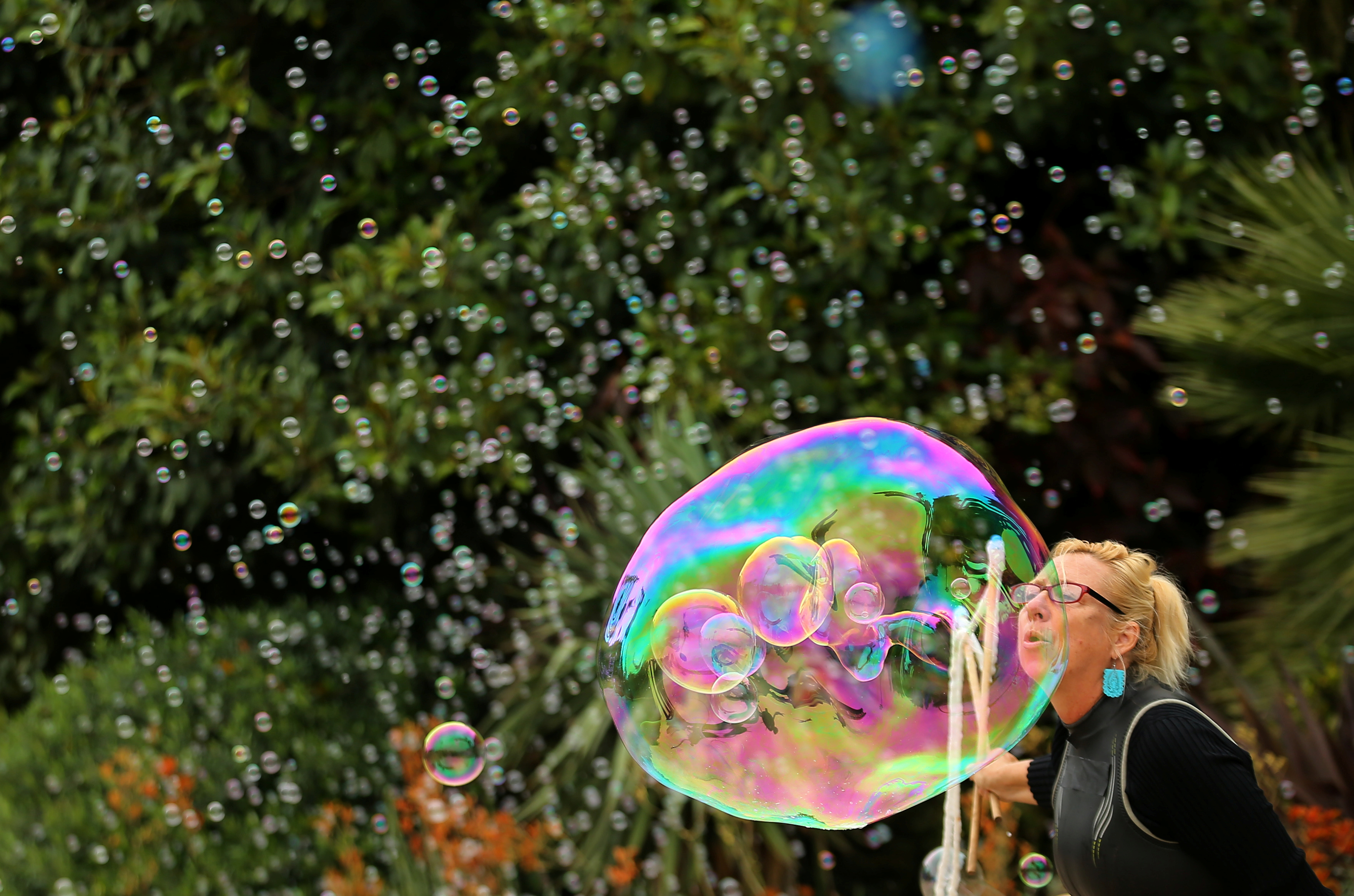 A woman makes a bubble during a performance at SeaWorld in San Diego, California.