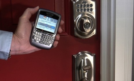 With Schlage&#039;s &quot;LiNK&quot; system, a smartphone can unlock your home by sending a signal through the internet to a wireless door lock.