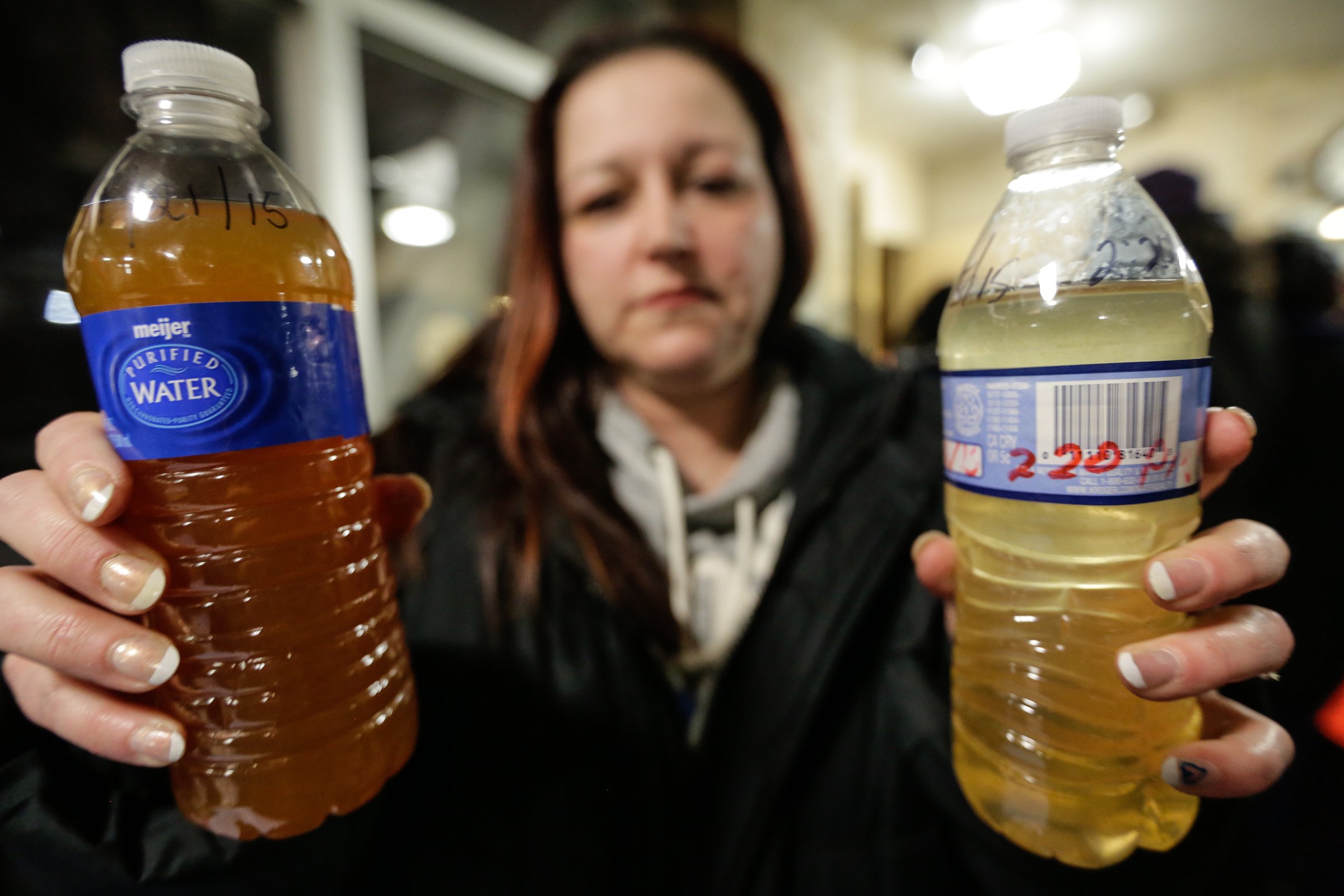 LeeAnne Walters 36 of Flint shows water samples from her home from Wednesday January 21, 2015.