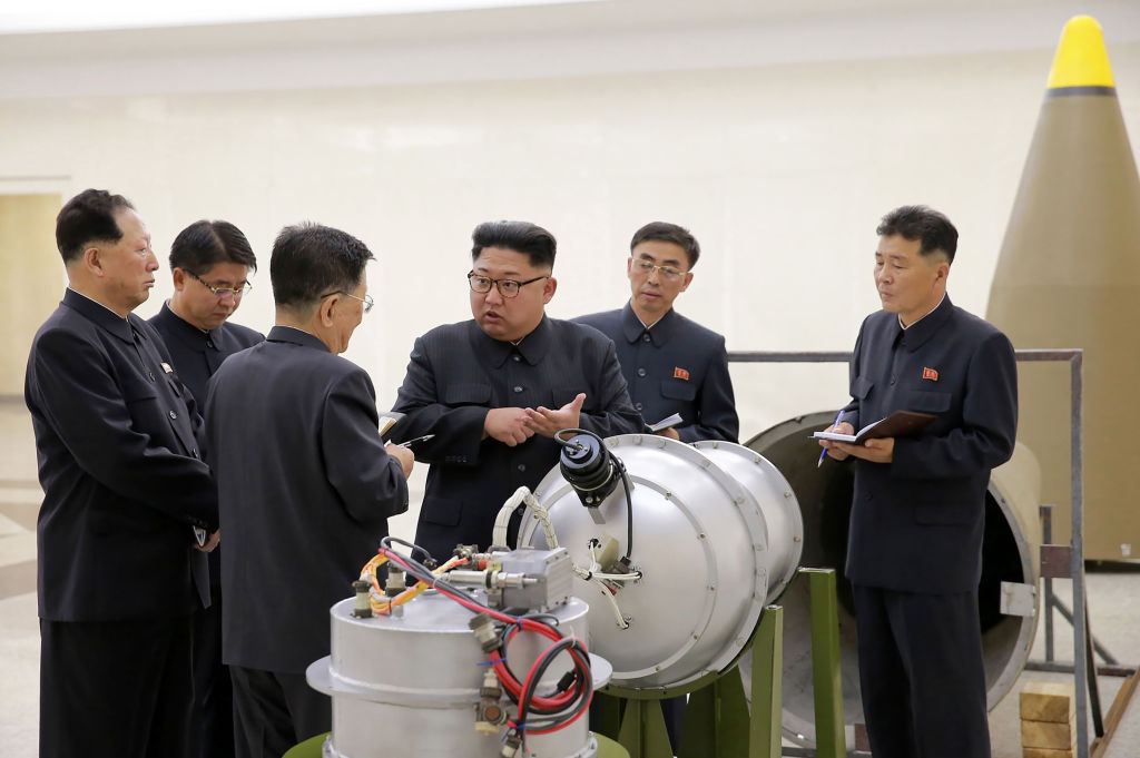 North Korean leader Kim Jong Un examines a device claimed to be a hydrogen bomb