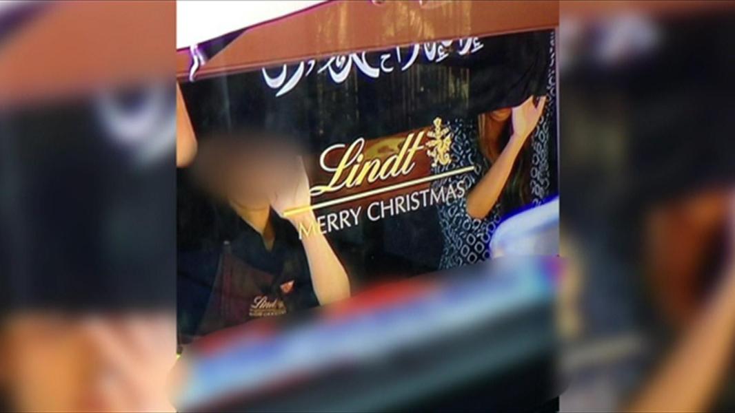 Gunman takes people hostage in Sydney cafe, shows black flag