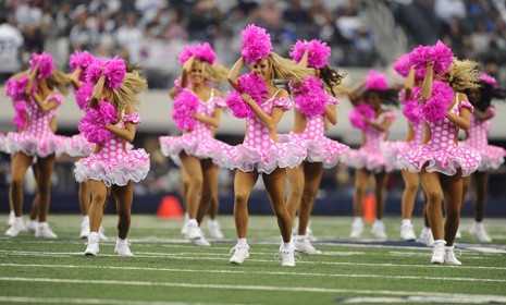 Pink-clad Dallas Cowboys cheerleaders were joined by 300 cancer survivors for a special breast cancer awareness halftime show earlier this month. 