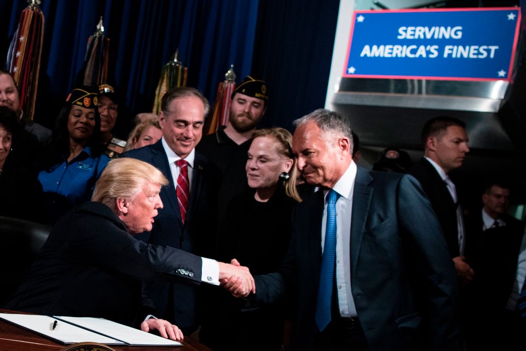 Ike Perlmutter shakes hands with Trump, with David Shulkin looking on