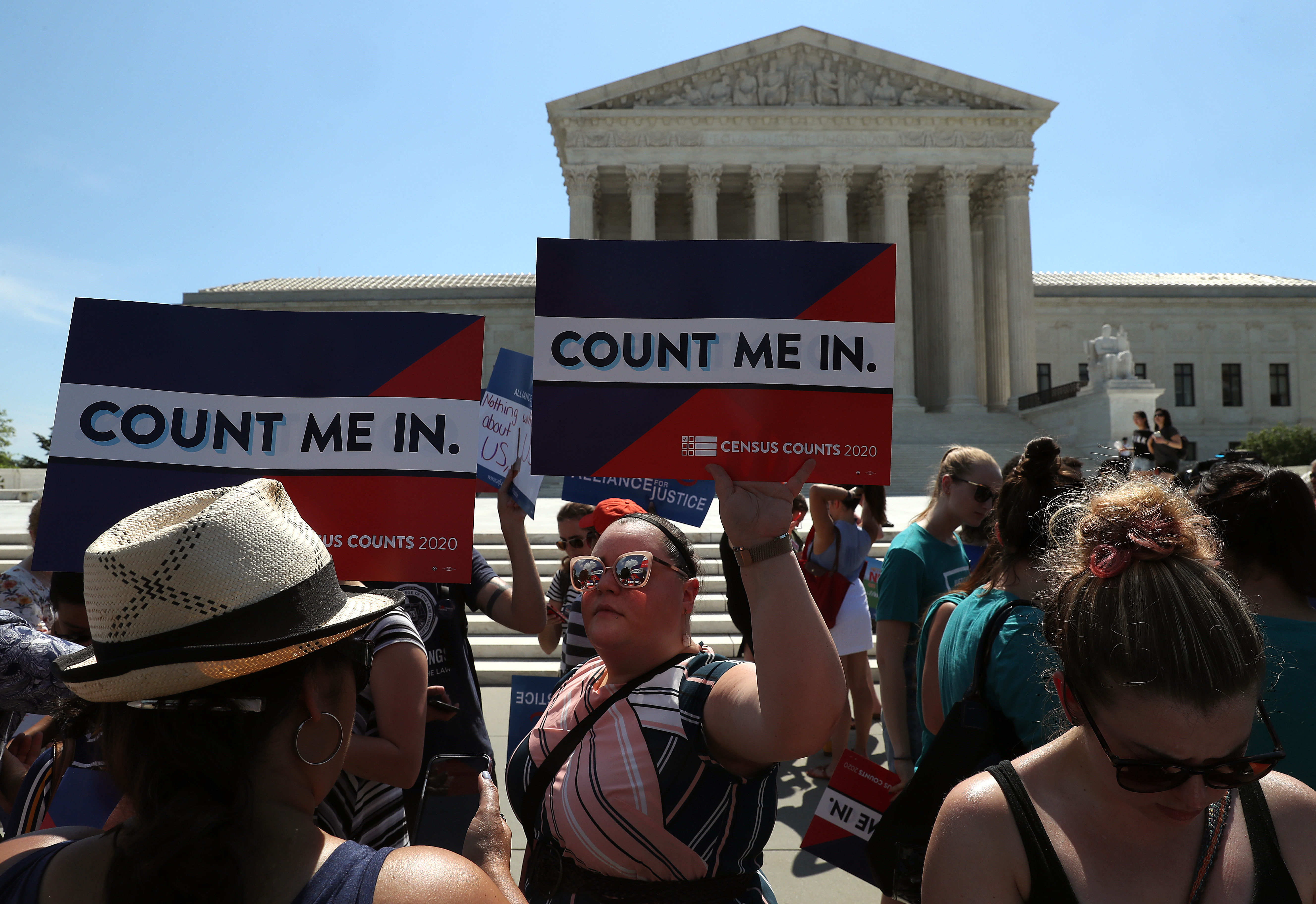 Protestors gather outside the Supreme Court to urge against adding a citizenship question to the United States census.