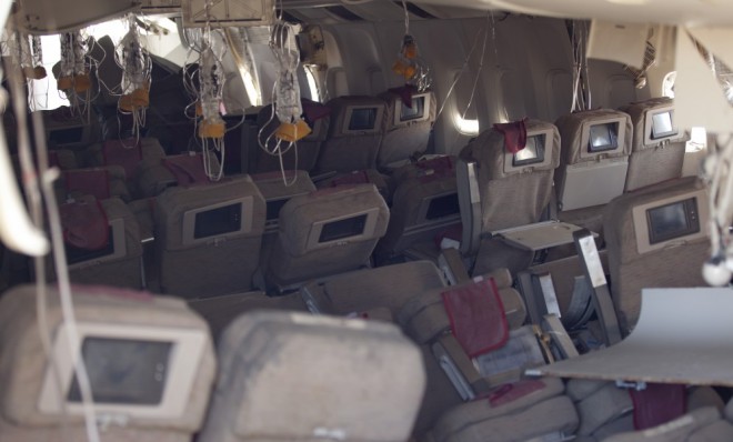 Oxygen masks hang from the ceiling in the cabin interior of Asiana Airlines flight 214.