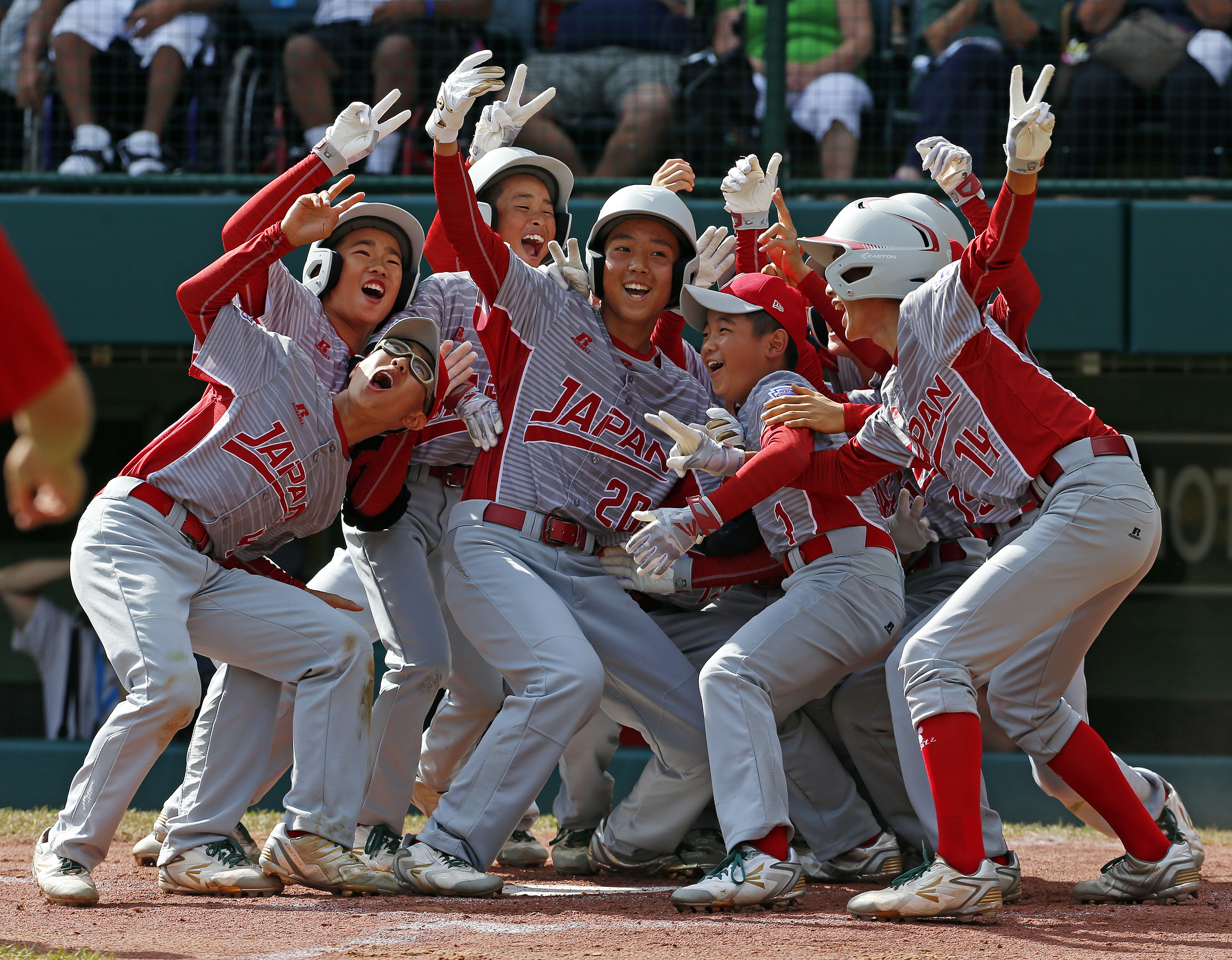 Tokyo&#039;s Little League baseball team celebrates a victory in Williamsport, Pennsylvania.