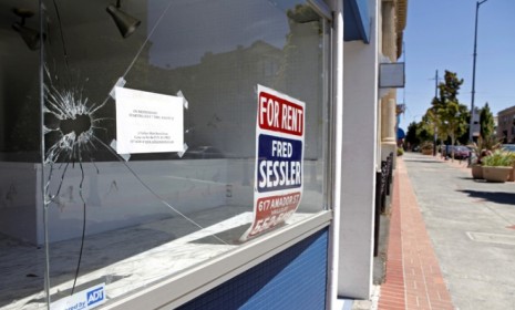 A broken window at an empty storefront in downtown Vallejo, Calif., a city that filed for bankruptcy protection in 2008.