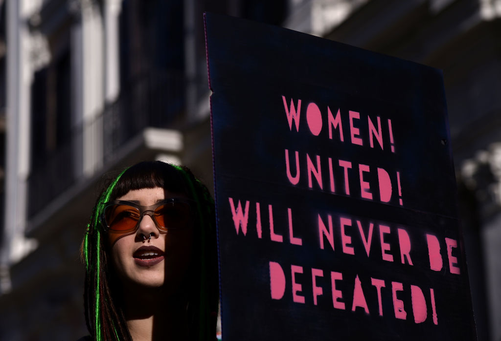 A Women&#039;s March 2018 demonstrator in Rome