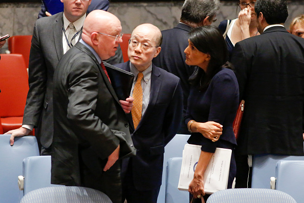 US Ambassador to the UN Nikki Haley speaks with Chinese Ambassador Liu Jieyi and Russian Ambassador Vasily Nebenzya.