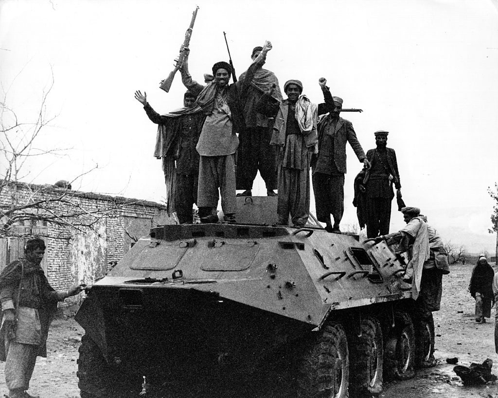 Afghans cheer atop captured Soviet tank