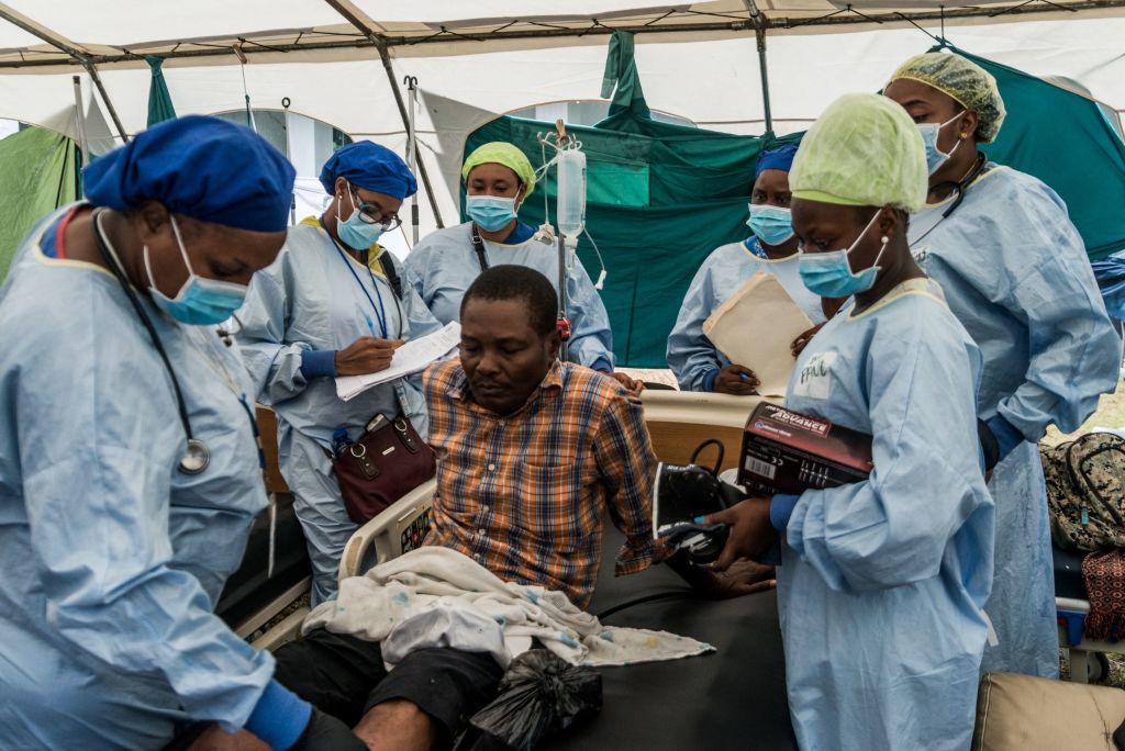 Doctors treat a patient in Haiti.