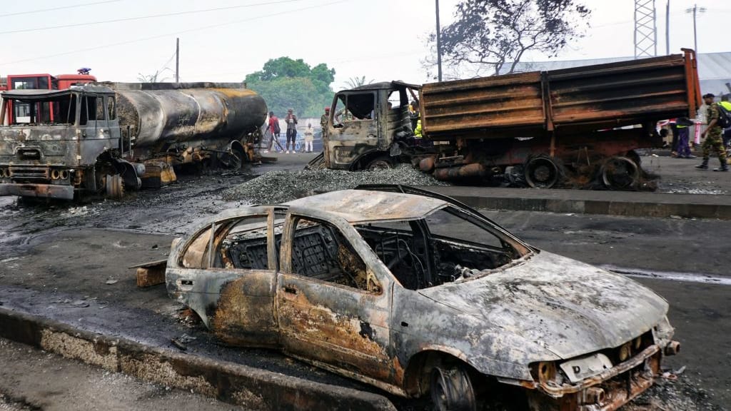 Cars damaged by the explosion in Sierra Leone.