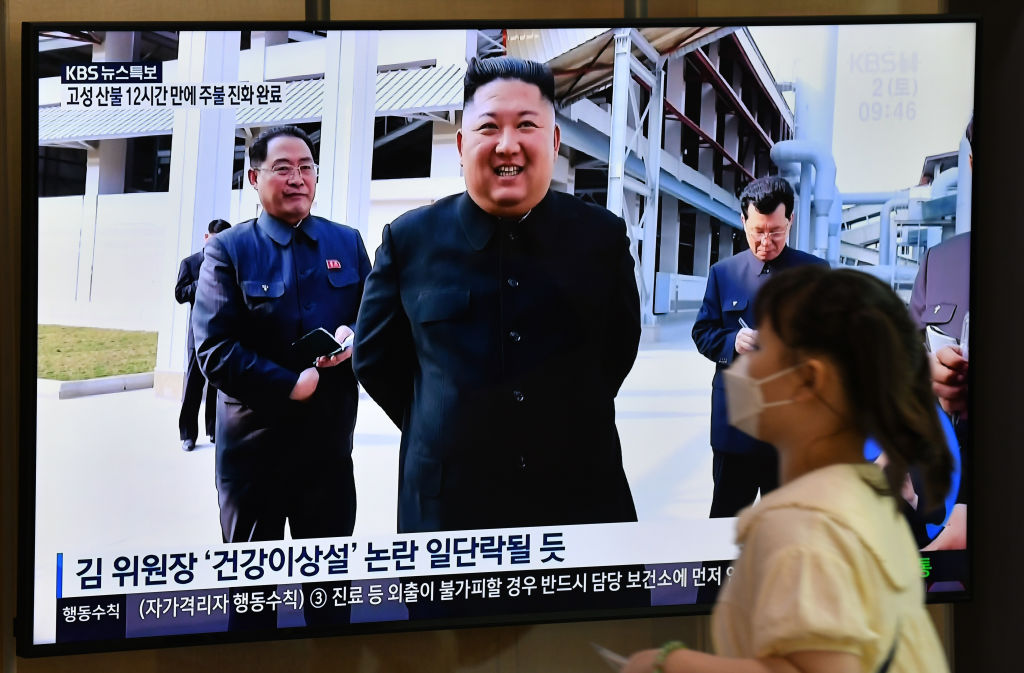 Woman watching Kim Jong-un on television