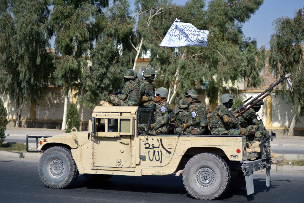 Afghan soldiers in captured American vehicle