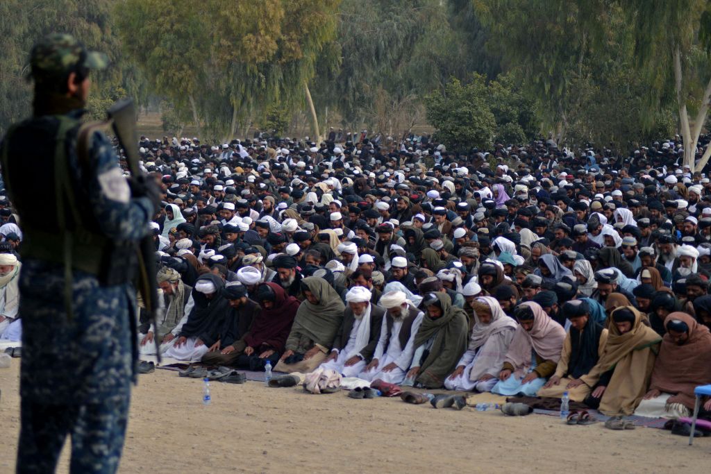 Taliban fighter observing Muslim prayers