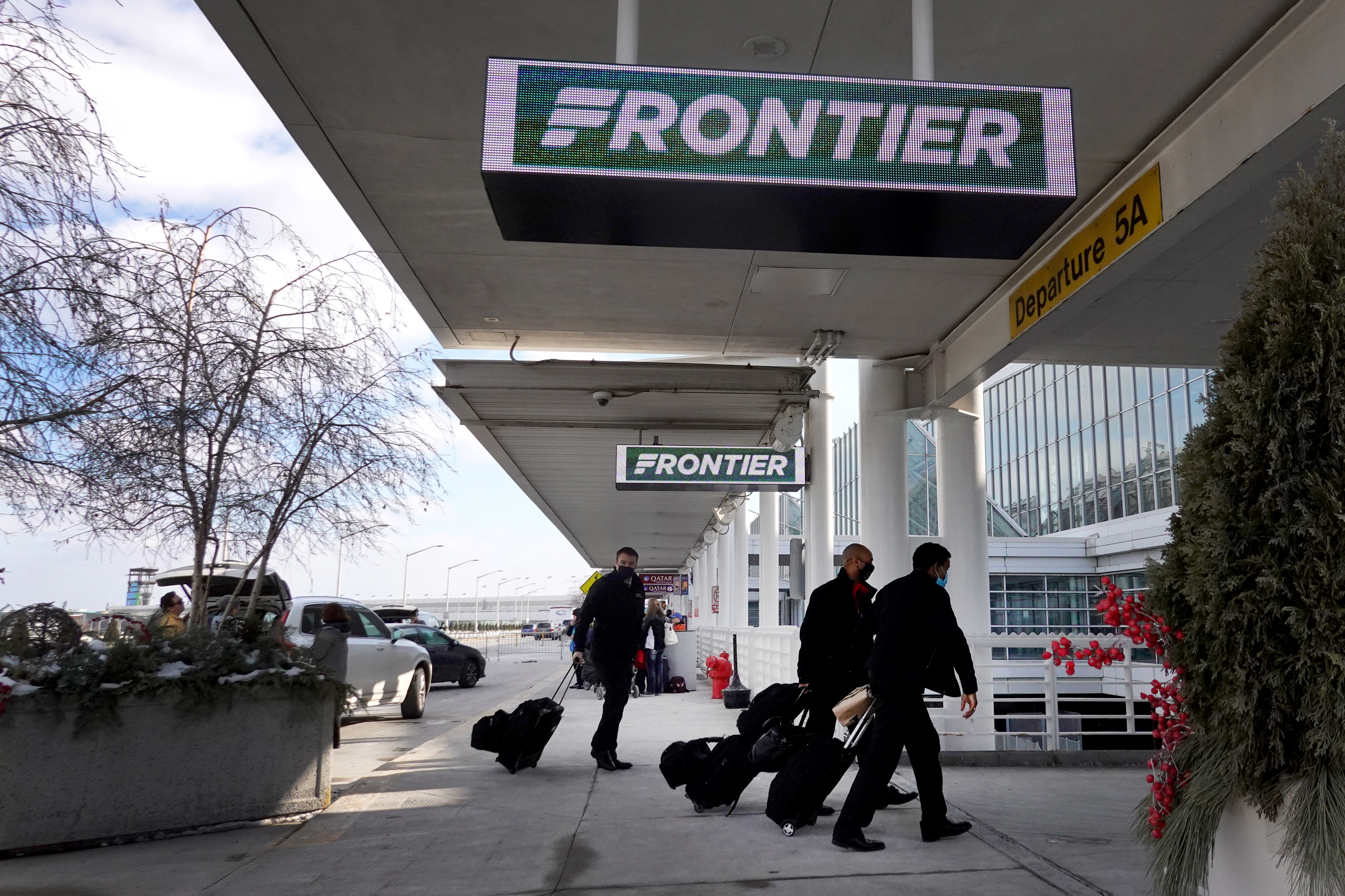 Passengers arrive for Frontier flights at Chicago&#039;s O&#039;Hare airport 