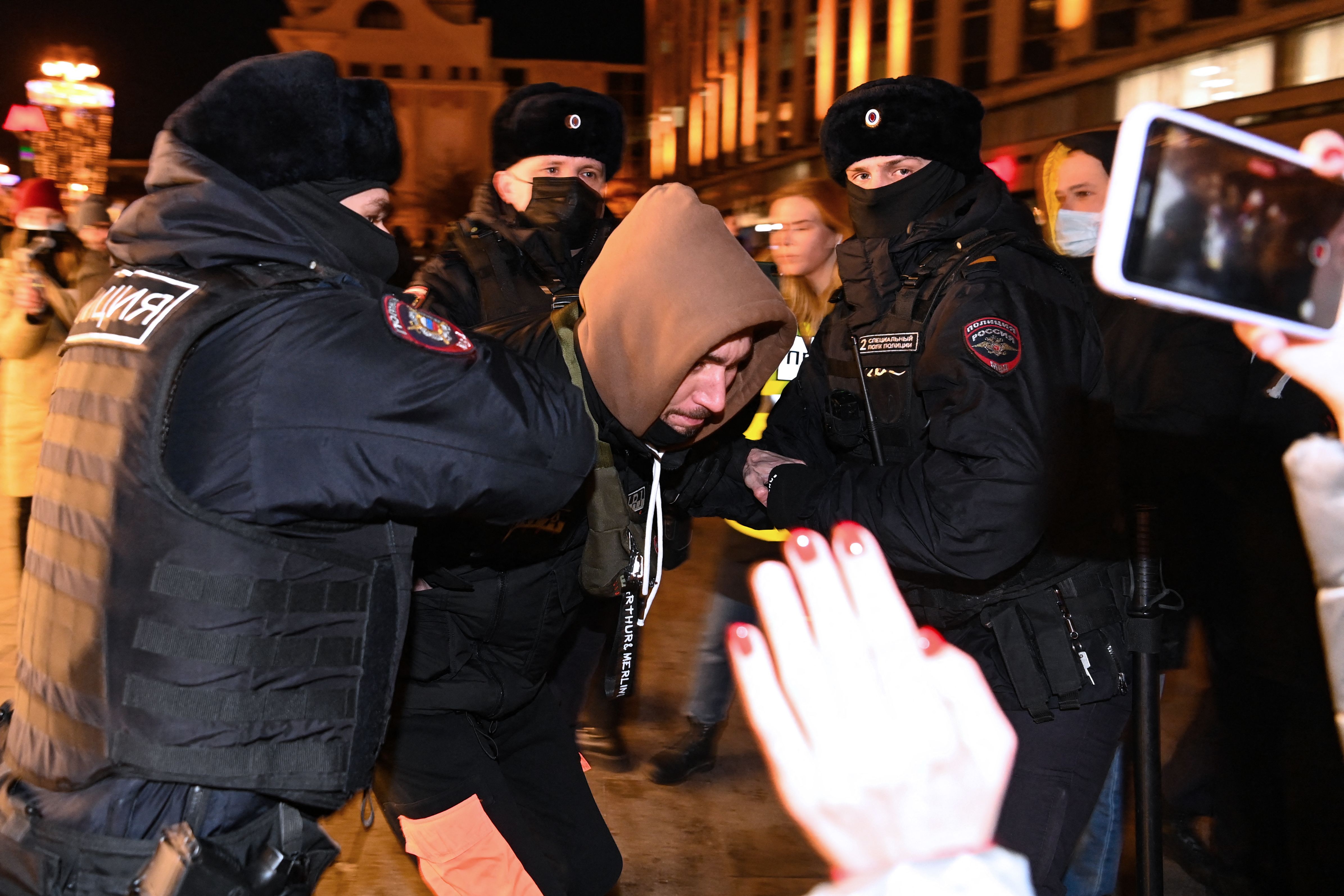 Moscow police detain an anti-war protester